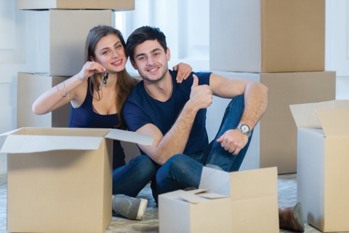 Professional movers packing household items