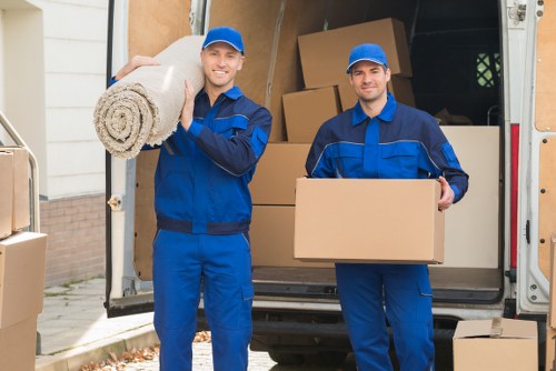 Team of movers handling items with care